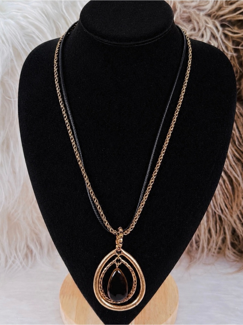 Beautiful, brass tone, black, floating pendant costume necklace